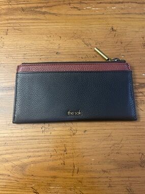 The Sak Black Leather wristlet with Gold-Tone Zipper